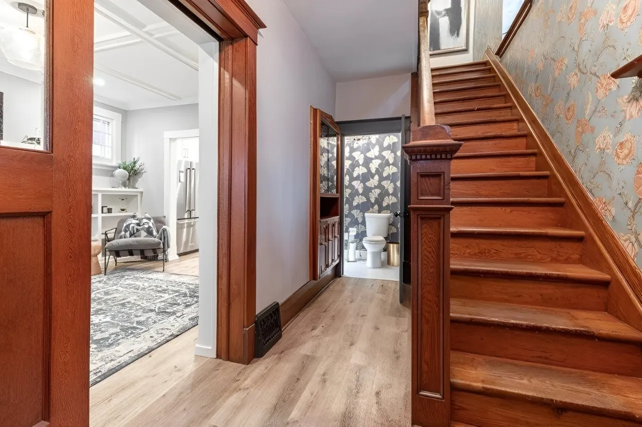 Century home entry with wood staircase